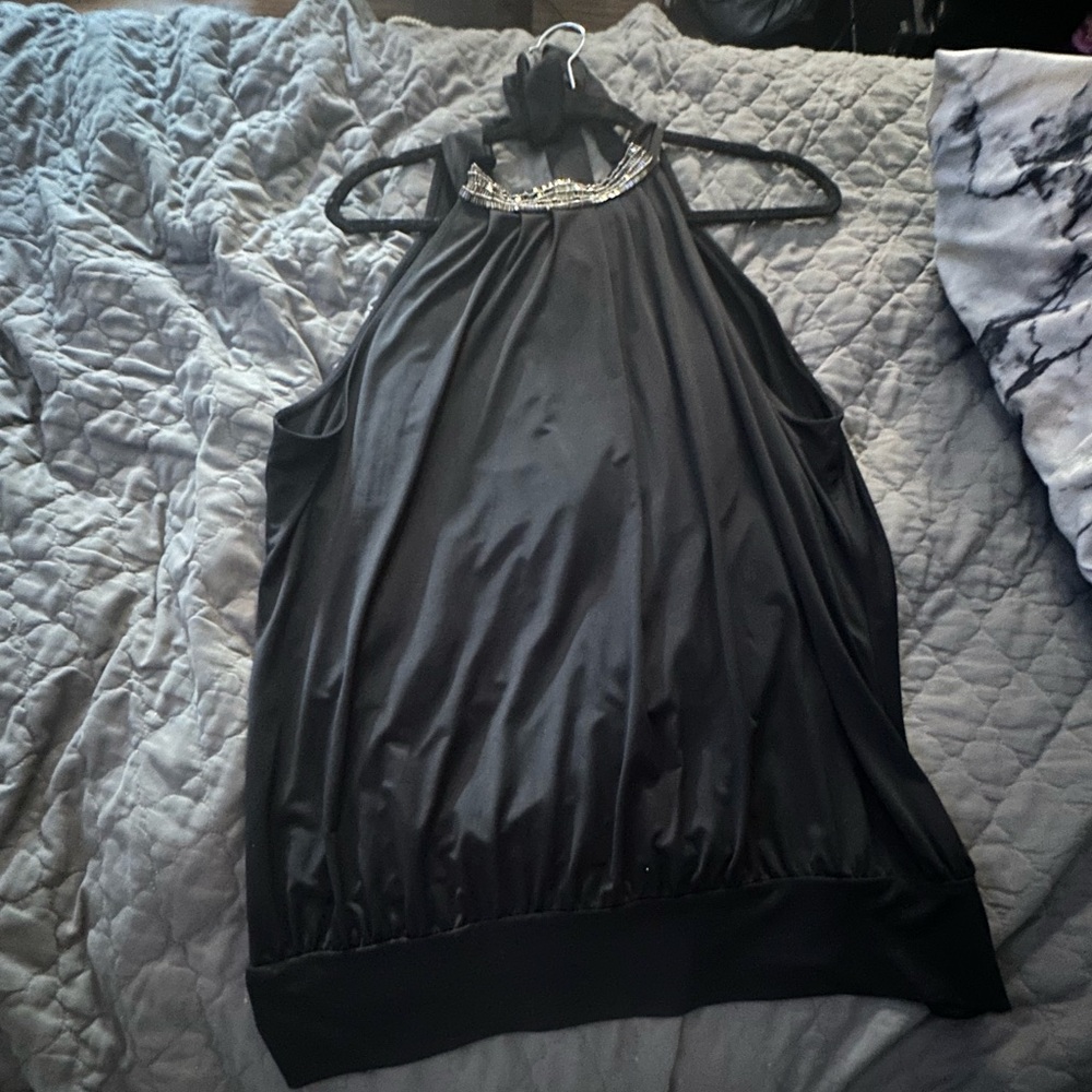 Black with silver/ gold design on neck . Size Large.